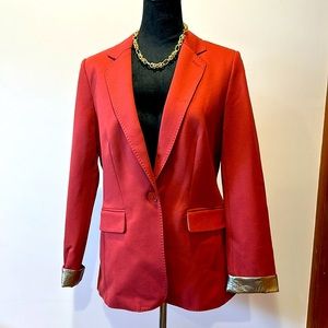 Coral jacket with gold accents